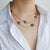 Tanzanite Stone and Gold Chain Necklace Worn Short on Model | Lily Gardner