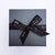 black gift box with Lily Gardner tied bow black and silver ribbon | LiIy Gardner London